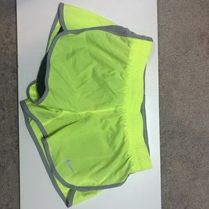 Neon yellow Nike running shorts